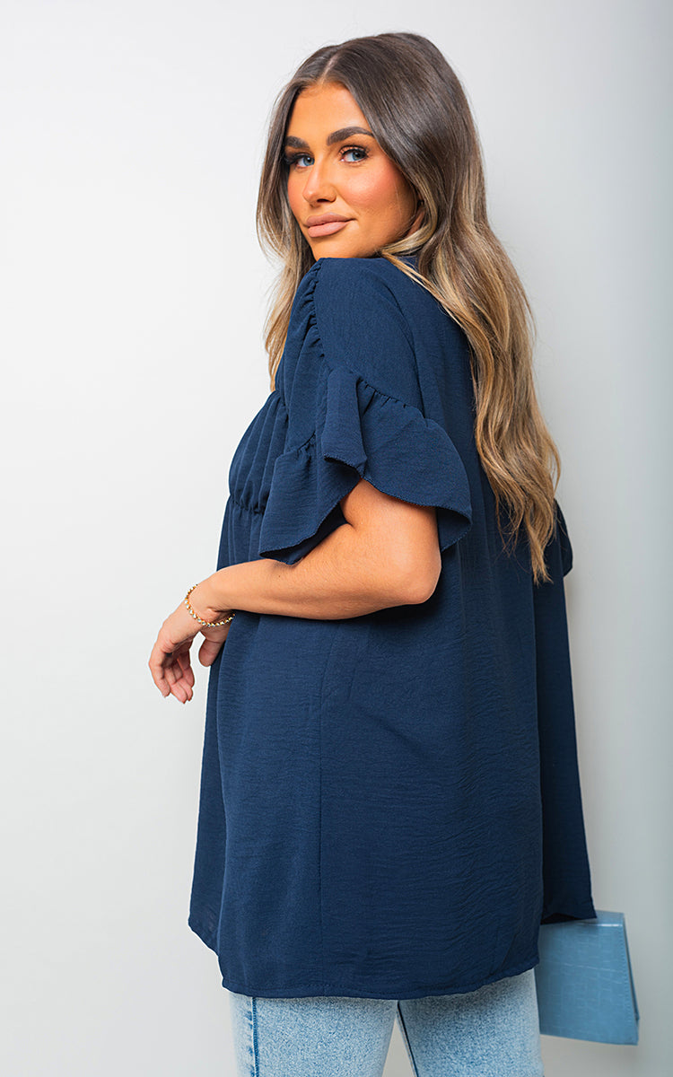 She Wears Glory™ Button Down Pleated Frill Tops