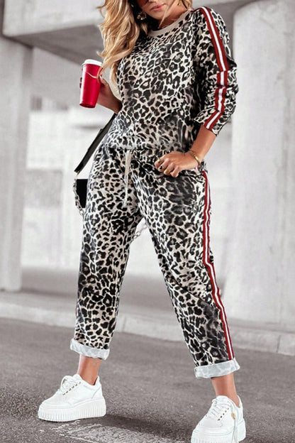 She Wears Glory™ “Fearless Radiance” Plus Size Leopard Round Neck Top and Pants Set - She Wears Glory Beverly Hills